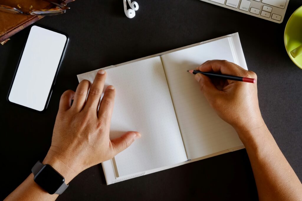 Man writing in a notepad