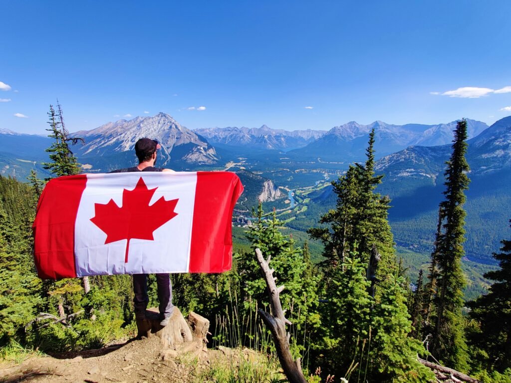 Canadian man on mountain showing canadian bet