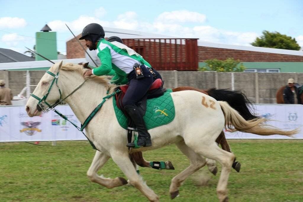 Man on horse, racing