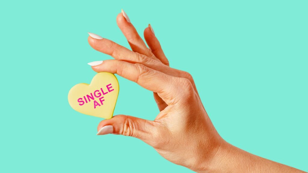single af as a mint woman holding it